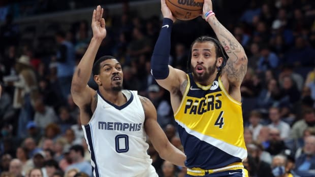 Pacers Duane Washington Jr. drives on De'Anthony Melton
